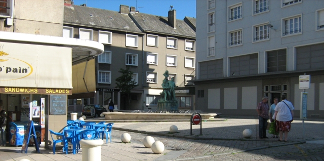 3 elderly people stand in an otherwise empty square in boulogne